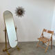 Old free-standing mirror in gilded brass in psychedelic neoclassical style Years 40 France