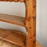 Vintage pine wall shelf with a scalloped front.