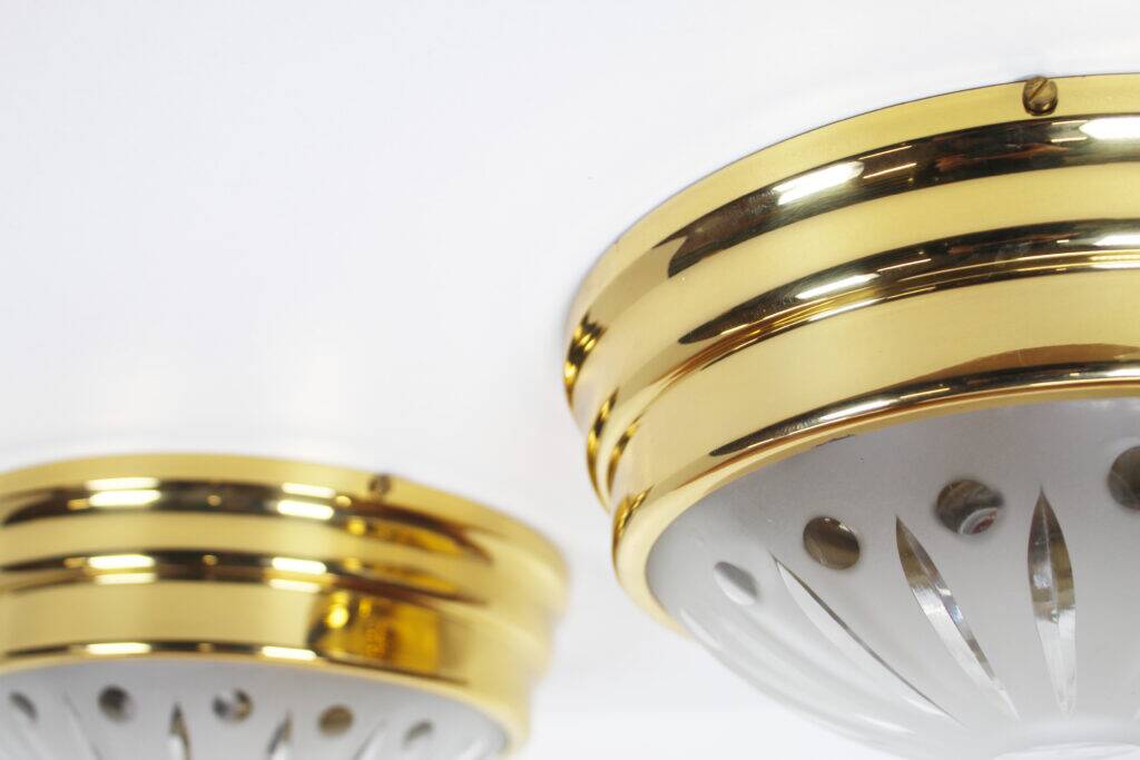 Pair of vintage brass ceiling lights with glass globe