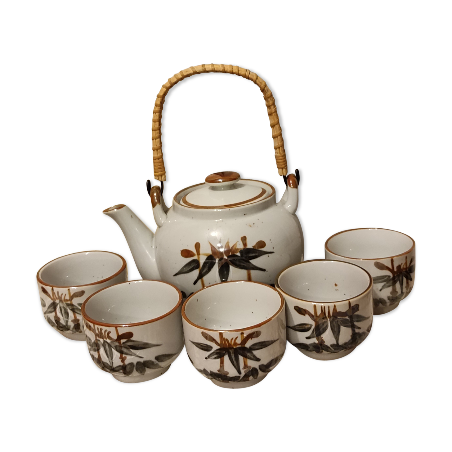 Asian set of a teapot and its cups
