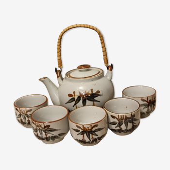 Asian set of a teapot and its cups