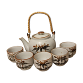Asian set of a teapot and its cups
