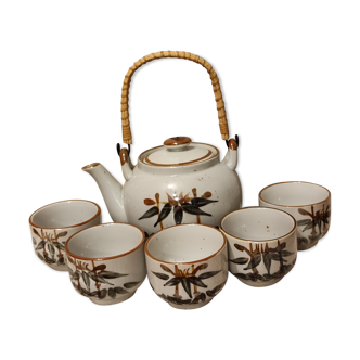 Asian set of a teapot and its cups