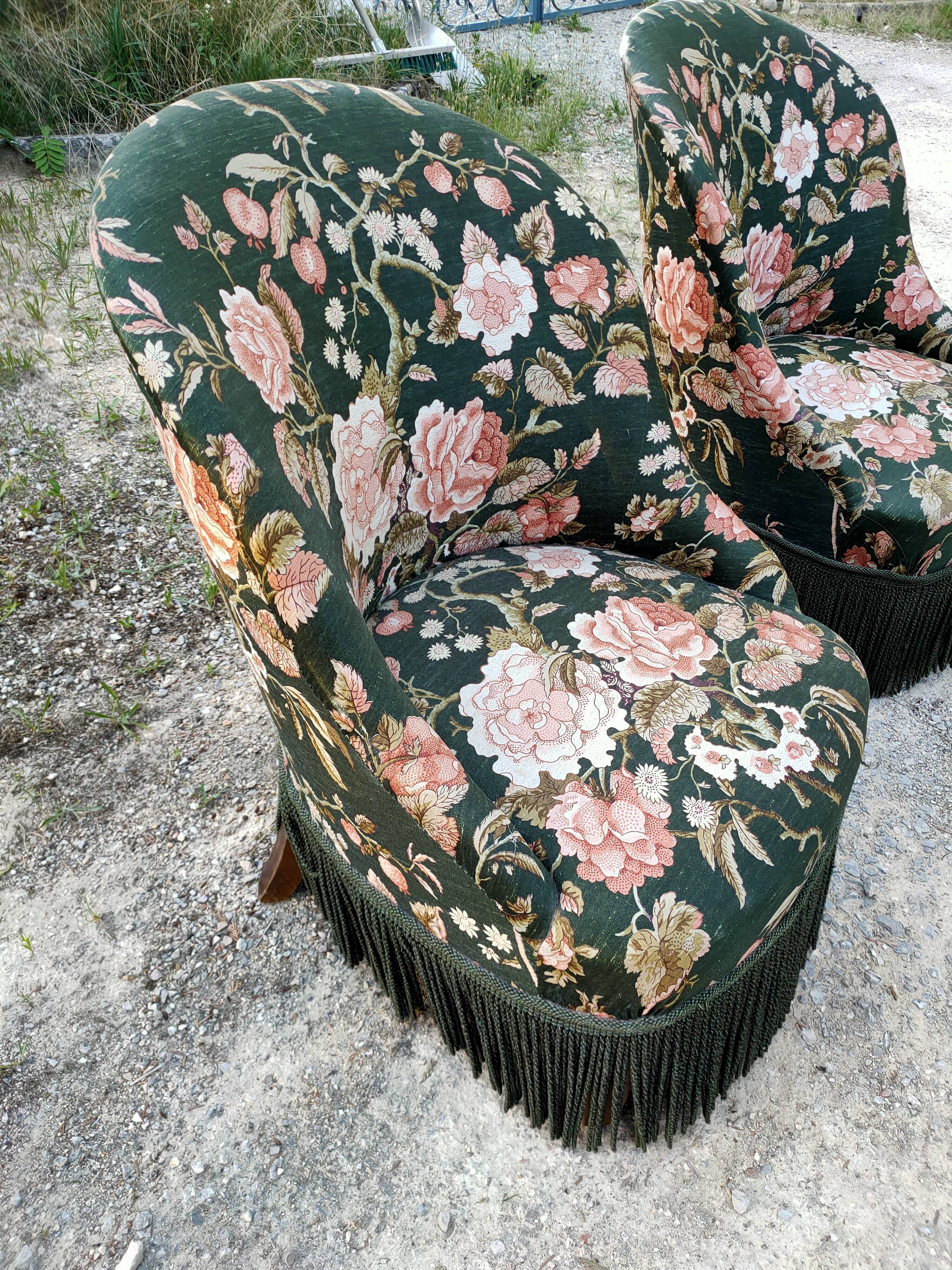 Two toad armchairs, floral motifs