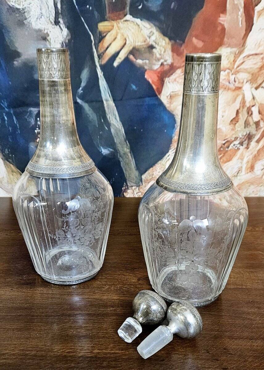 Pair of antique crystal and solid silver decanters.