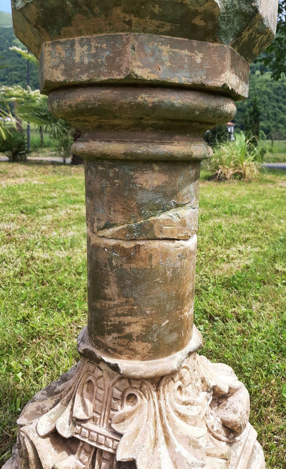 Holy water font on stone column (17th century)
