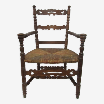 Antique armchair with armrests