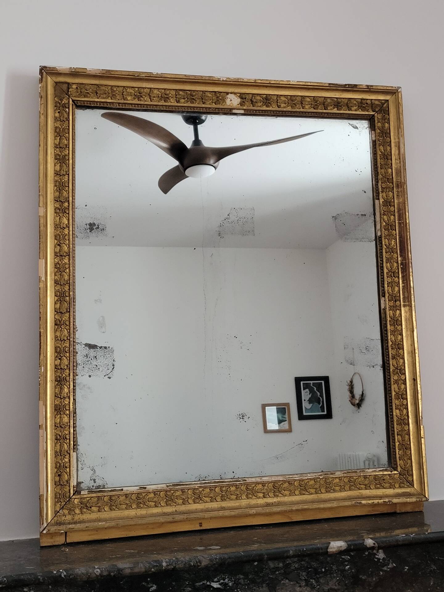 Golden stucco and wood Empire mirror