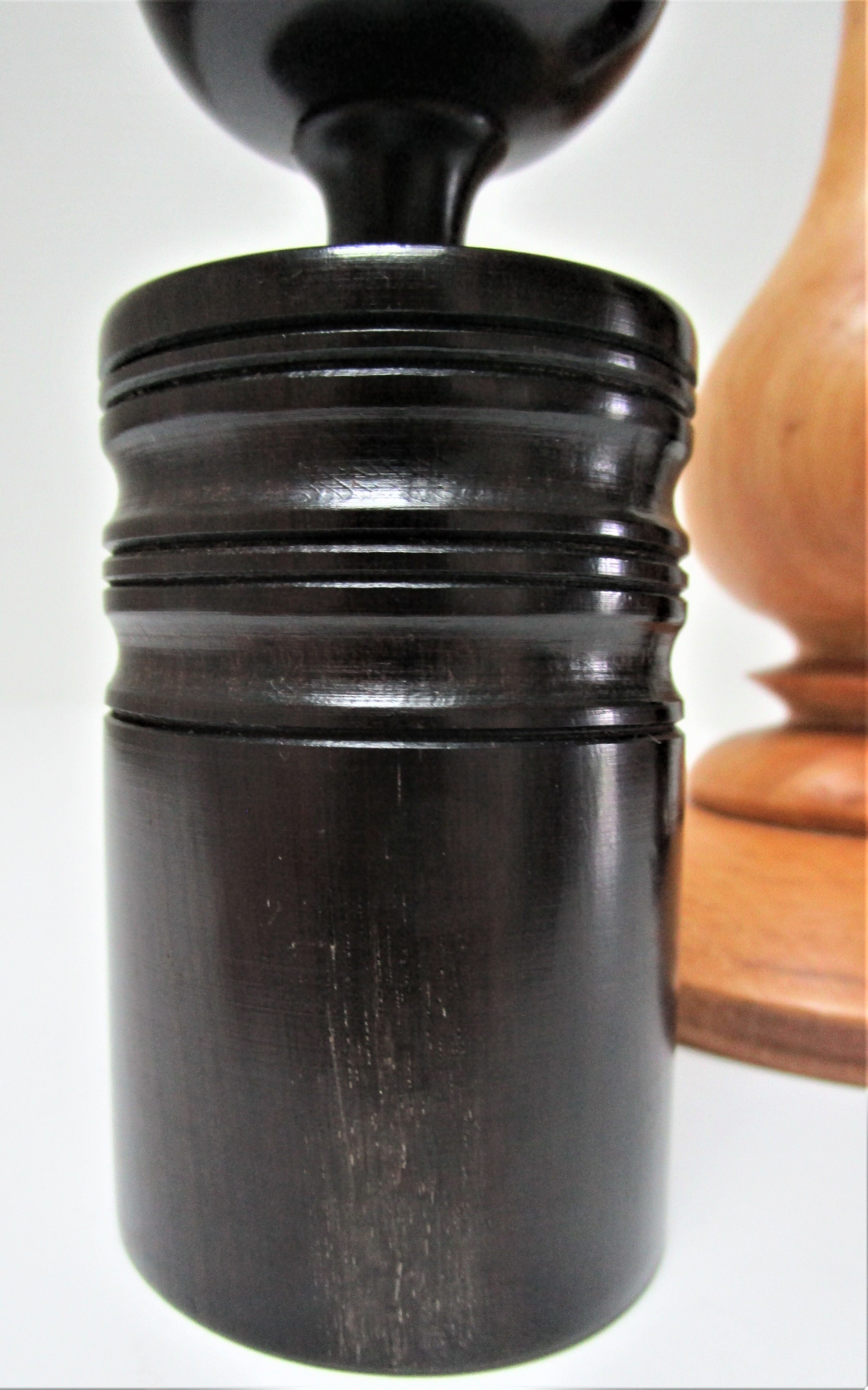 Three vintage light and dark wood candlesticks