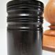 Three vintage light and dark wood candlesticks