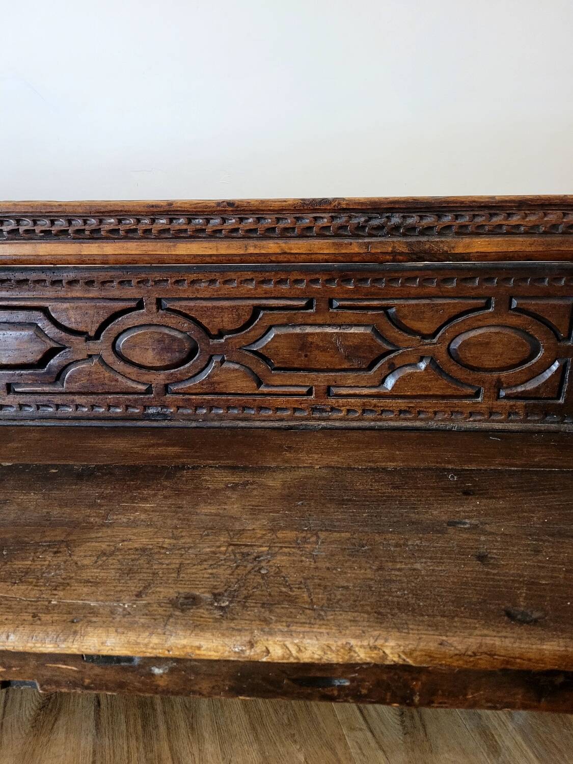Antique carved solid wood bench from the early 20th century