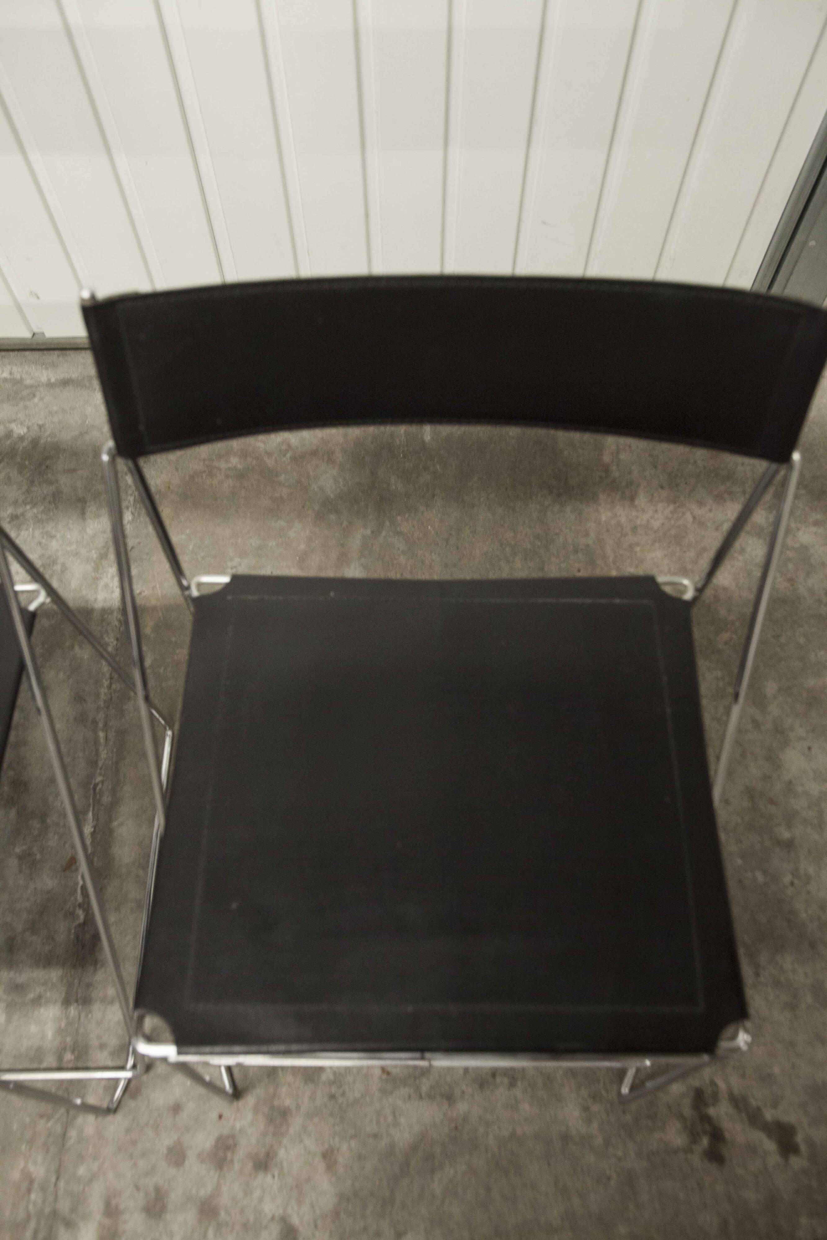 Set of 3 minimalist X line chairs by Niels Jorgen Haugesen.