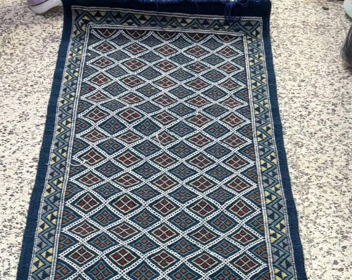 Hand-woven blue hallway rug in natural wool