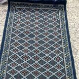 Hand-woven blue hallway rug in natural wool