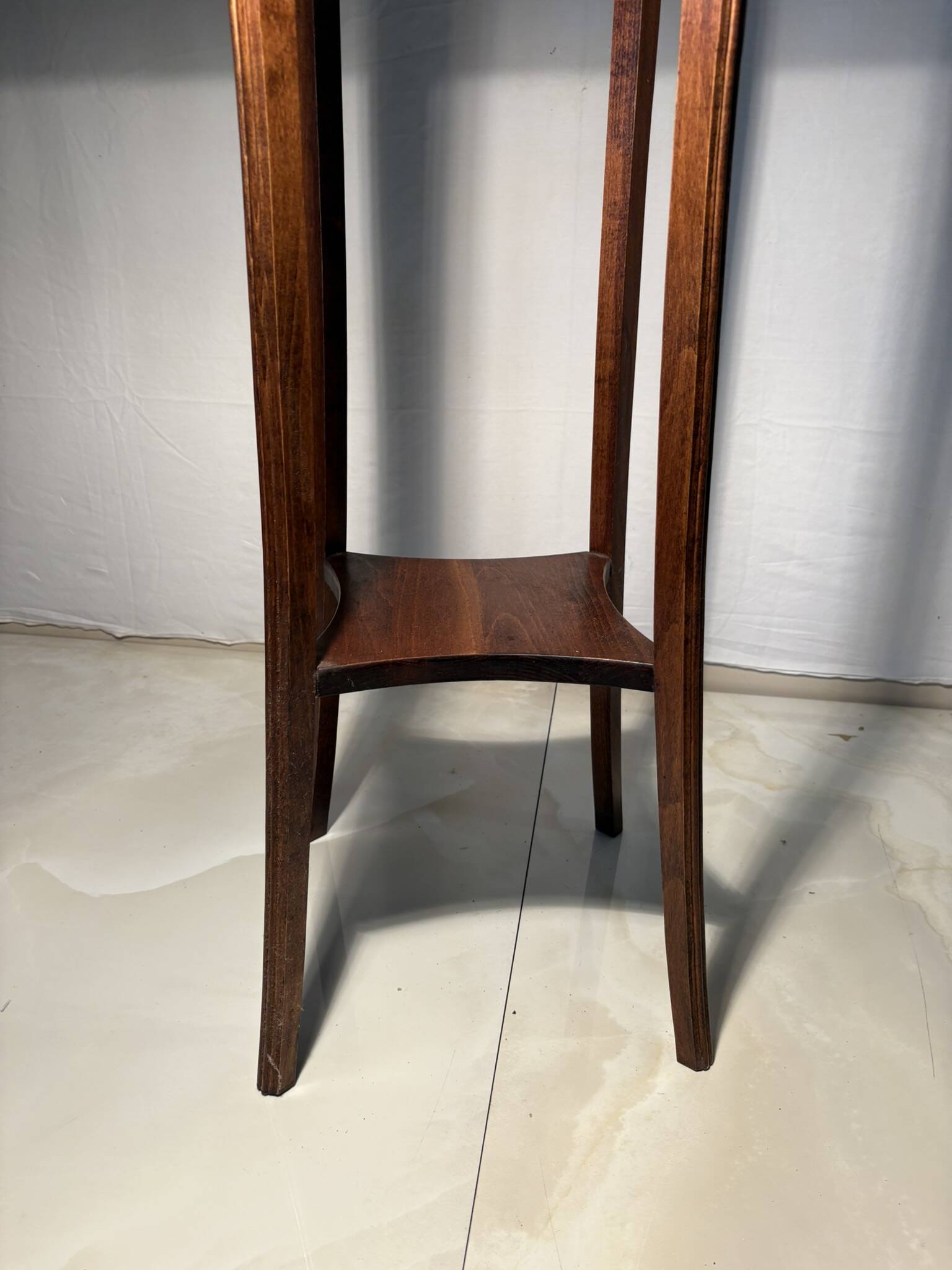 Vintage dark wood side table with curved base