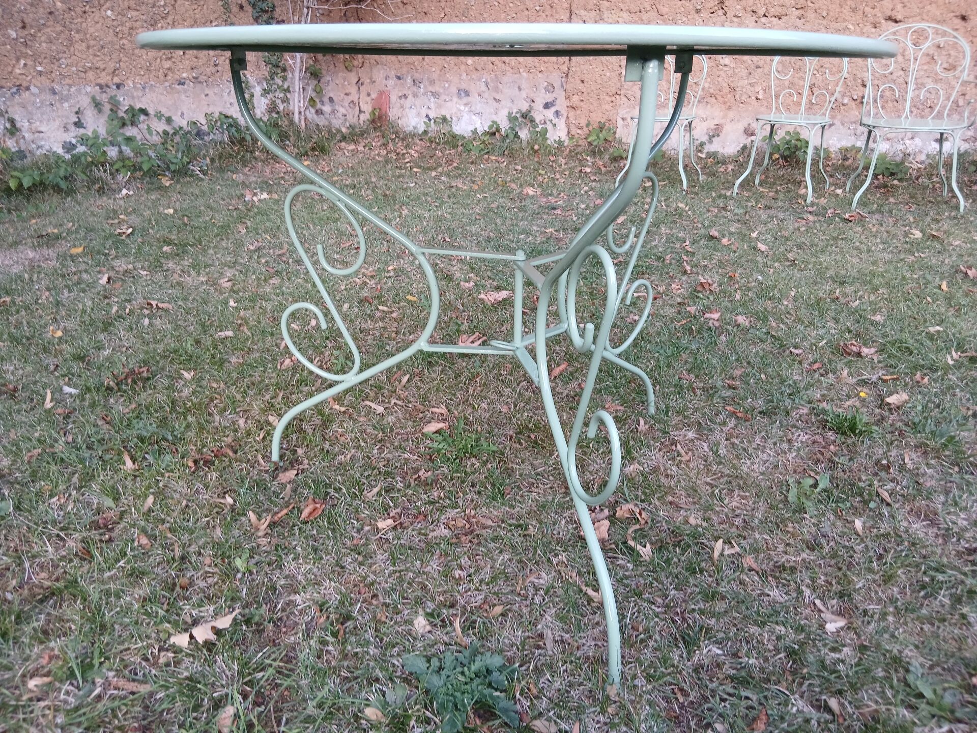 Garden furniture set with 1 table, 2 armchairs, and 2 chairs in antique green wrought iron.