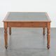 Antique writing table / partner desk with 4 drawers and a green leather top