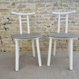 Pair of wooden and Skaï chairs from the 80s, Italy