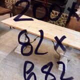 Industrial table with sandblasted top and bleached legs.