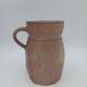 Pitcher in folk art sandstone
