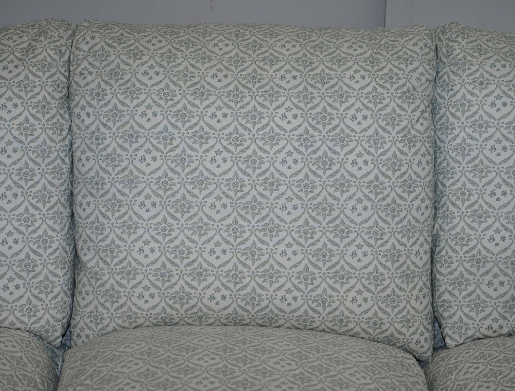 Howard & Sons canapé with feather cushions and ticking fabric, Victorian style.