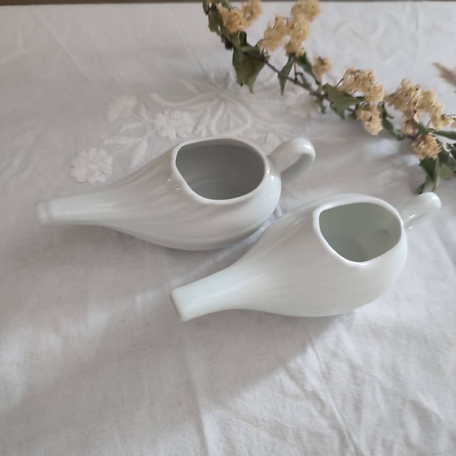 Duo of old white porcelain sauce boats for sick baby bottles