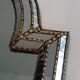 Mirror consisting of multi-faceted mirrors and brass garlands, French work, around 1970
