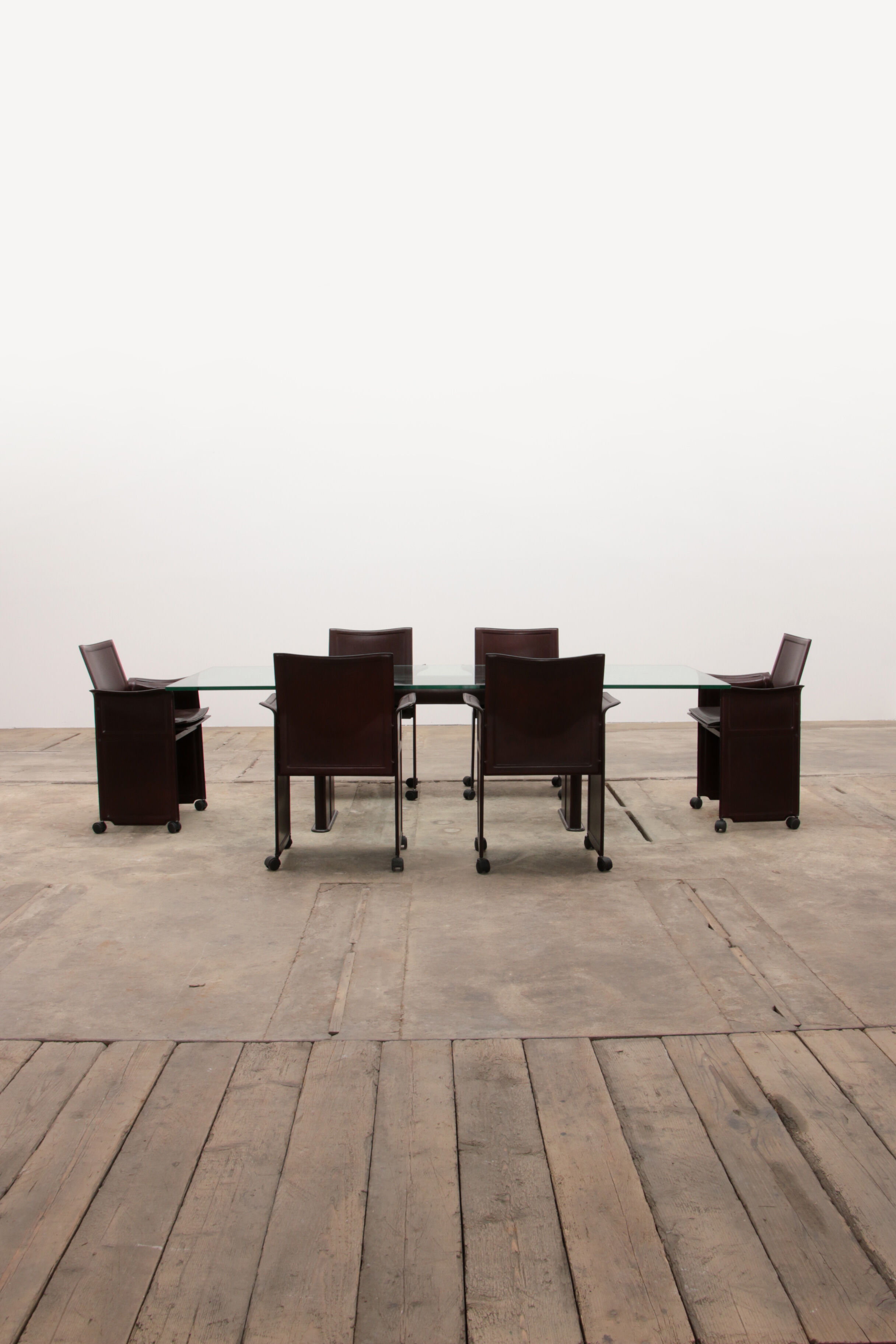 Tito Agnoli for Matteo Grassi leather dining table and six chairs