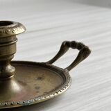 Brass candle holder with handle.