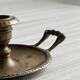 Brass candle holder with handle.