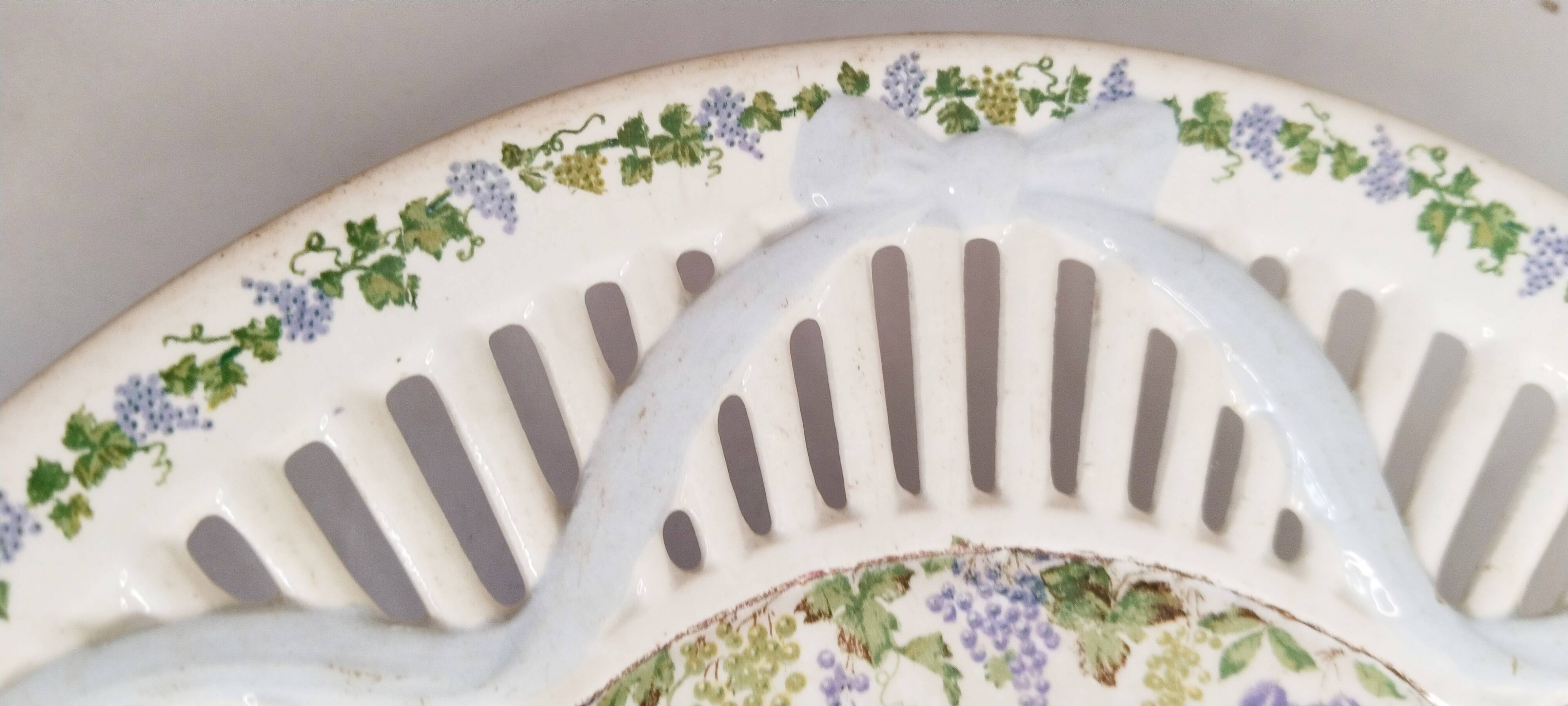 Oval dish in openwork earthenware from Sarreguemines, blue ribbon and fruit