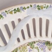 Oval dish in openwork earthenware from Sarreguemines, blue ribbon and fruit