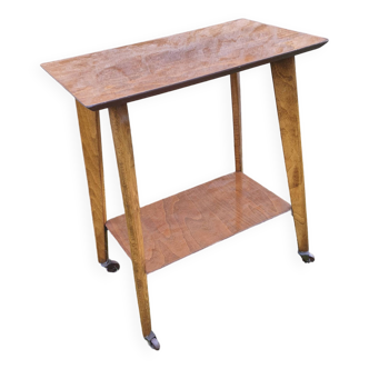 Vintage wooden side table on casters