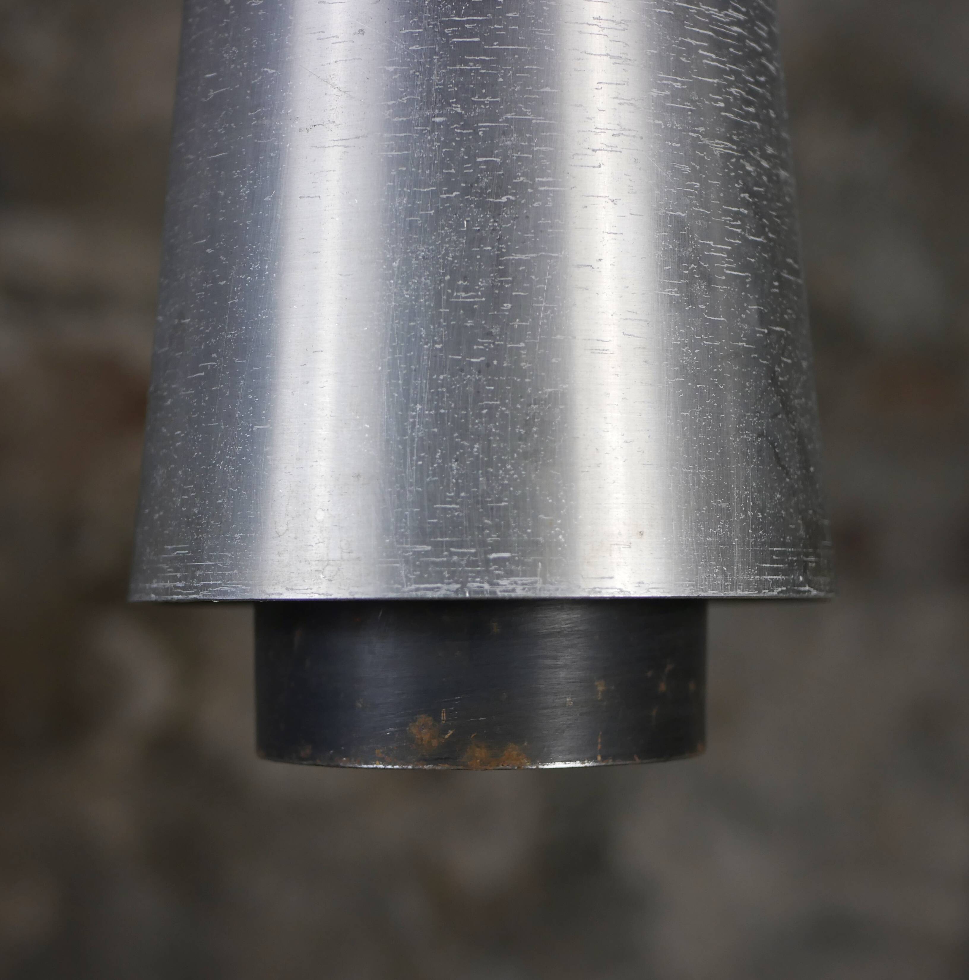 Trio of Raak steel pendant lights, 1960s