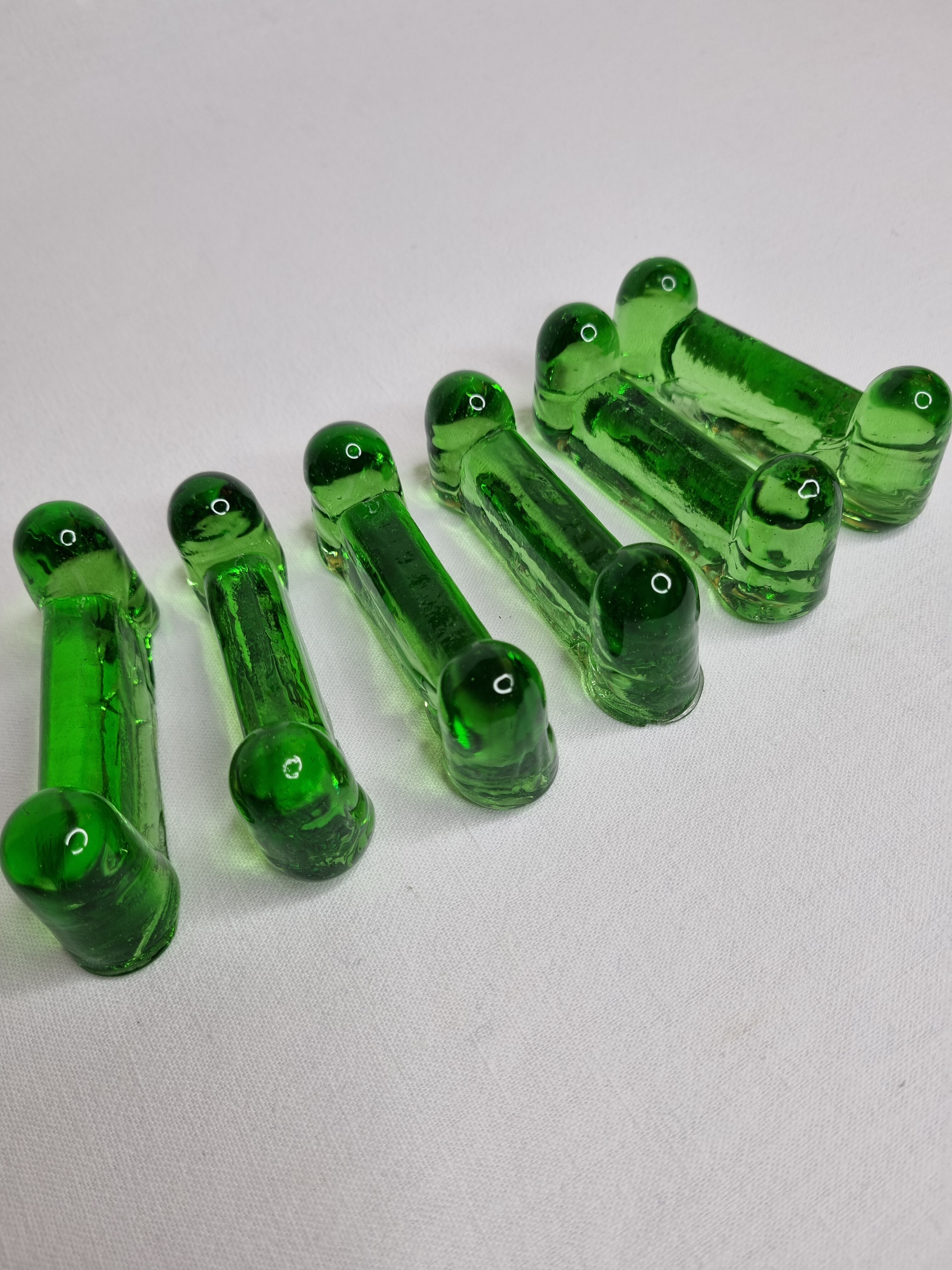 Set of six emerald glass knife holders signed Biot