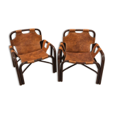 Pair of Tito Agnoli armchairs in leather and bamboo, 1970s.