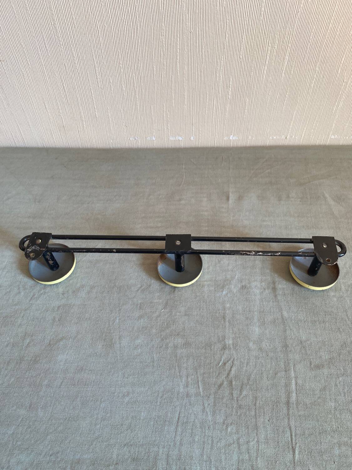 2 black and yellow metal wall coat racks