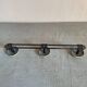 2 black and yellow metal wall coat racks