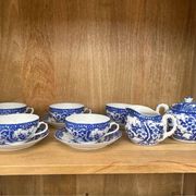 Japanese porcelain service with lithophany, blue and white floral decorations.