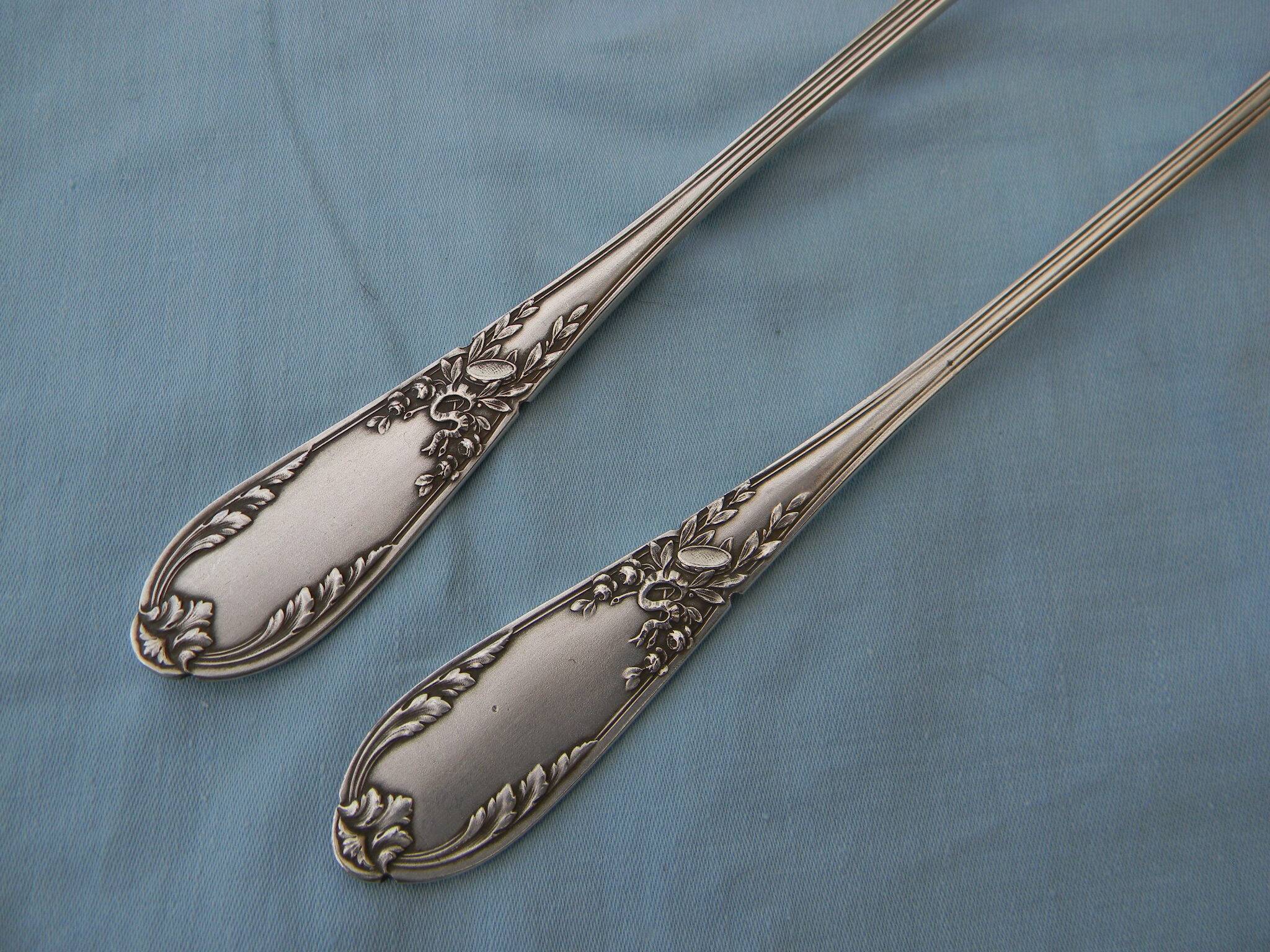 SFAM silver metal salad servers.