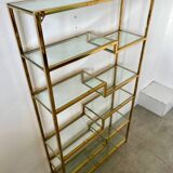 Old shelf in golden metal brass geometric library design 80s vintage