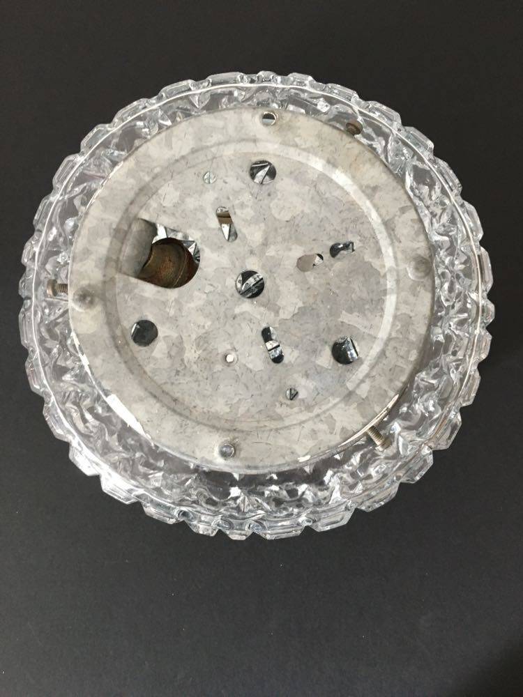 Round ceiling or wall lamp in worked glass. Gray metal support
