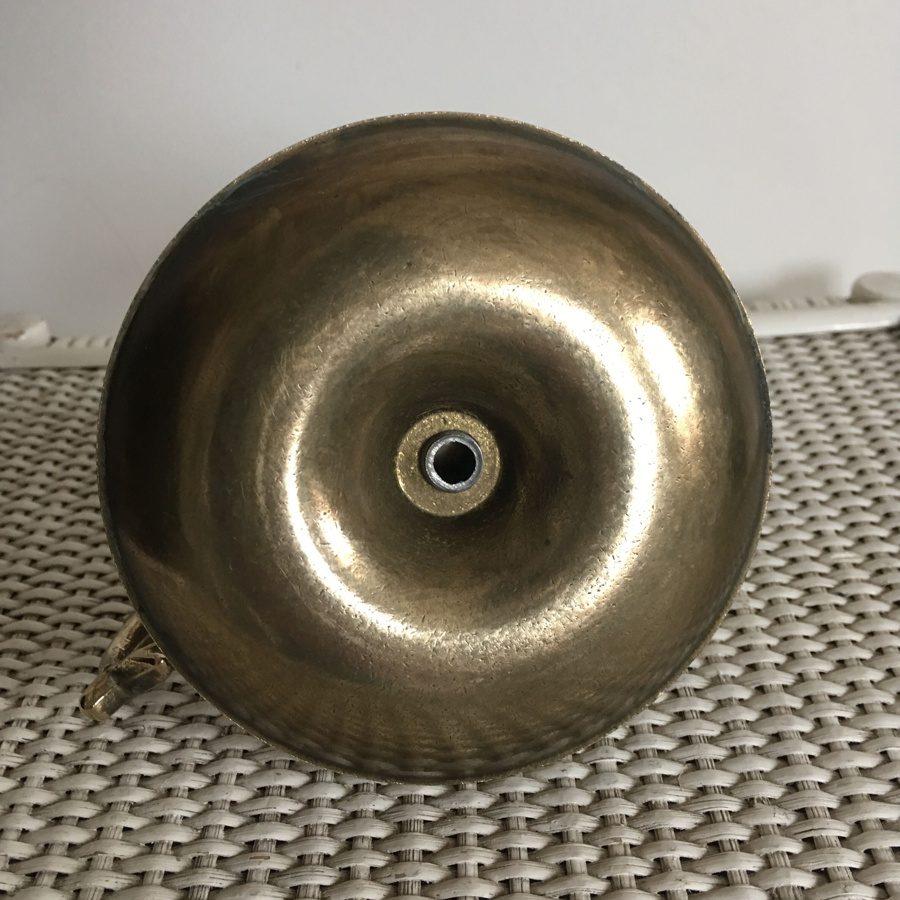 Old brass candlestick called "rat tail"