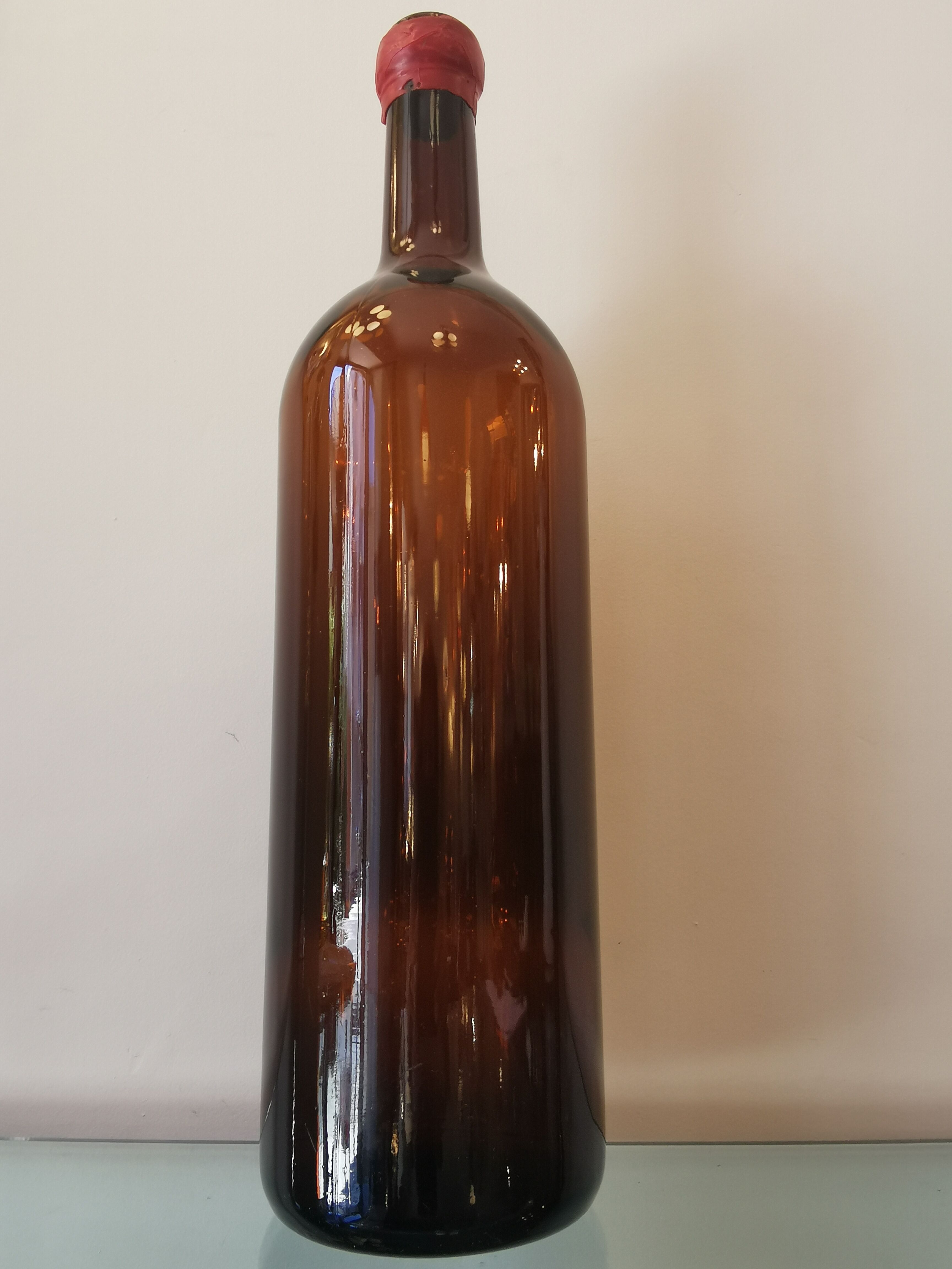 Vintage xxl bottle (46cm)in amber blown glass