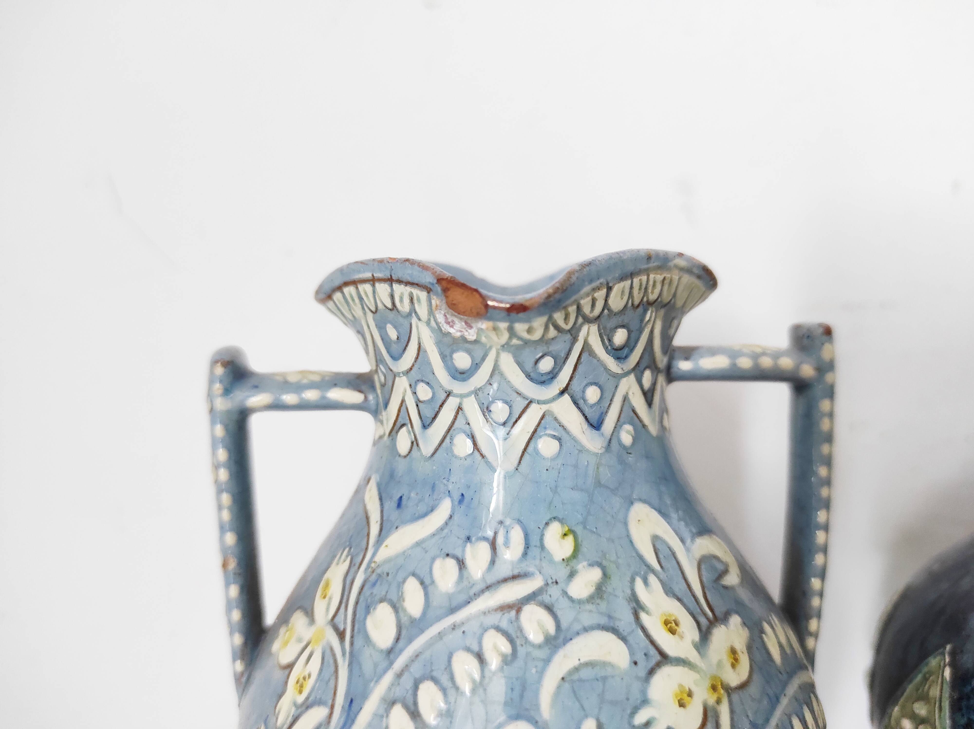 Two small blue ceramic vases