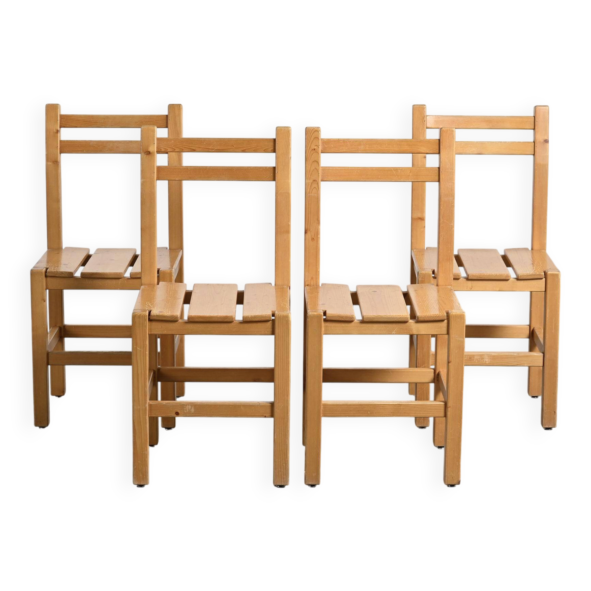 Set of four solid pine chairs by Maison Regain.
