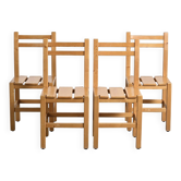 Set of four solid pine chairs by Maison Regain.