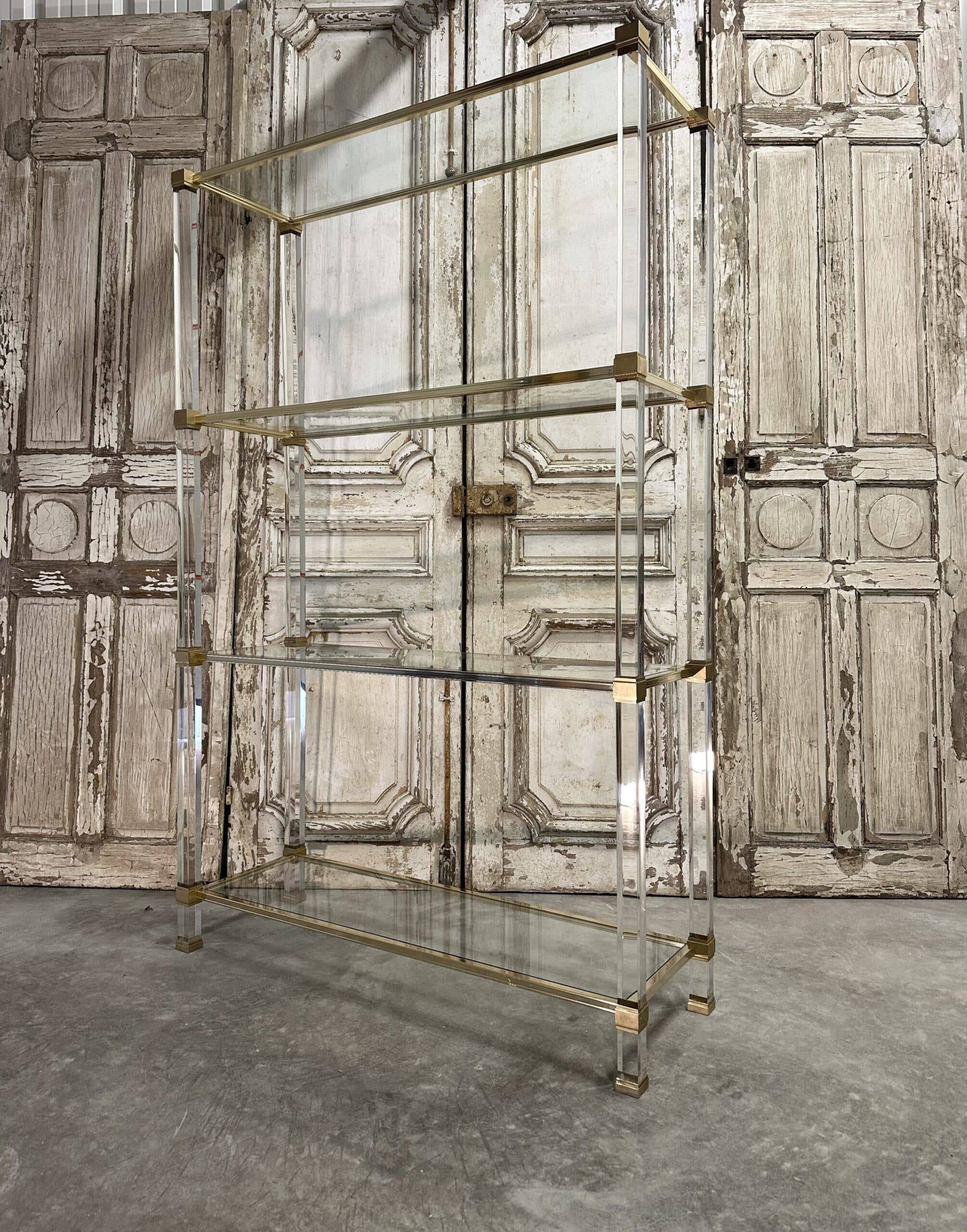 Plexiglass shelf by Pierre Vandel in Hollywood Regency style circa 1970.