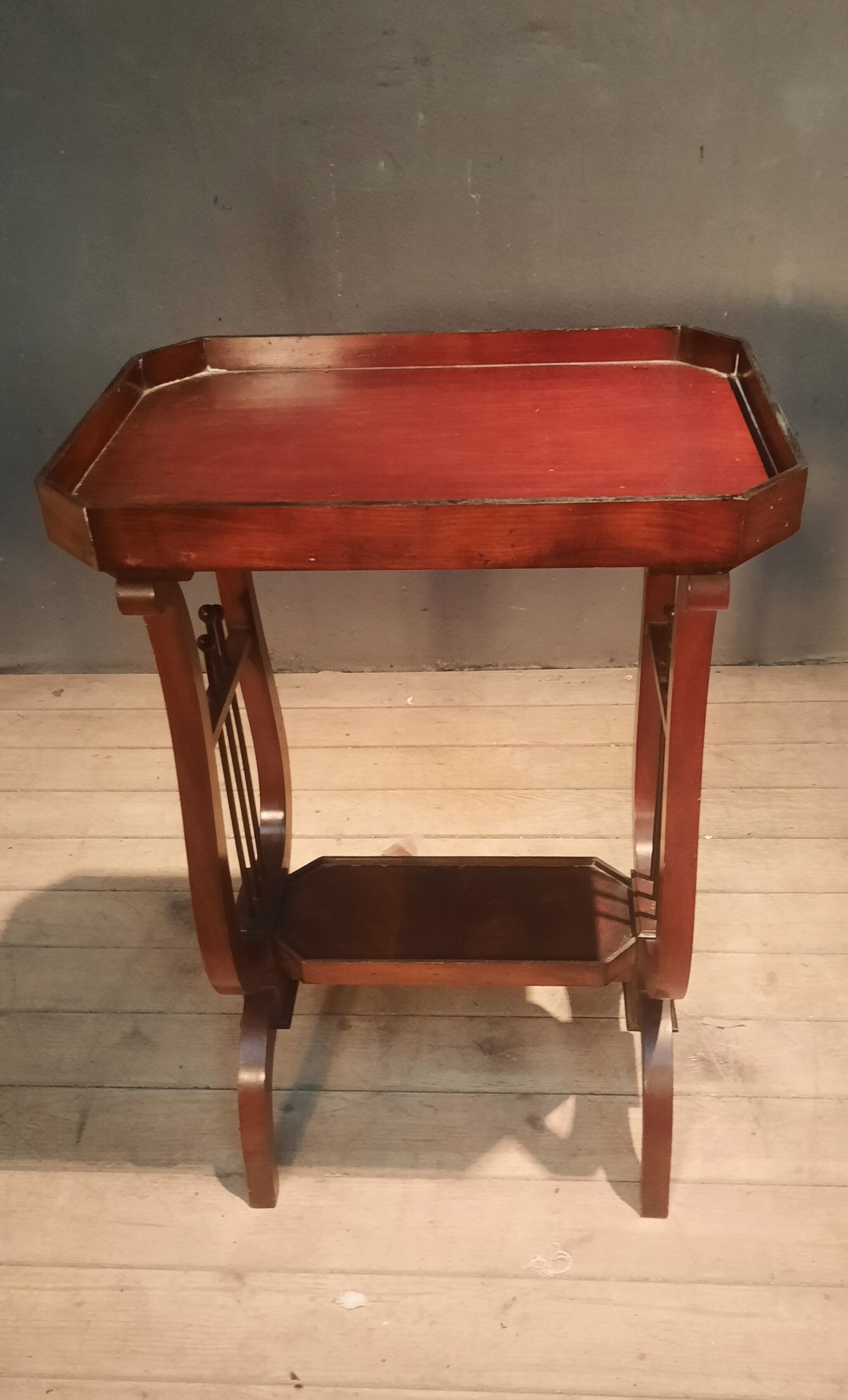 19th-century worker with a lyre footstool.