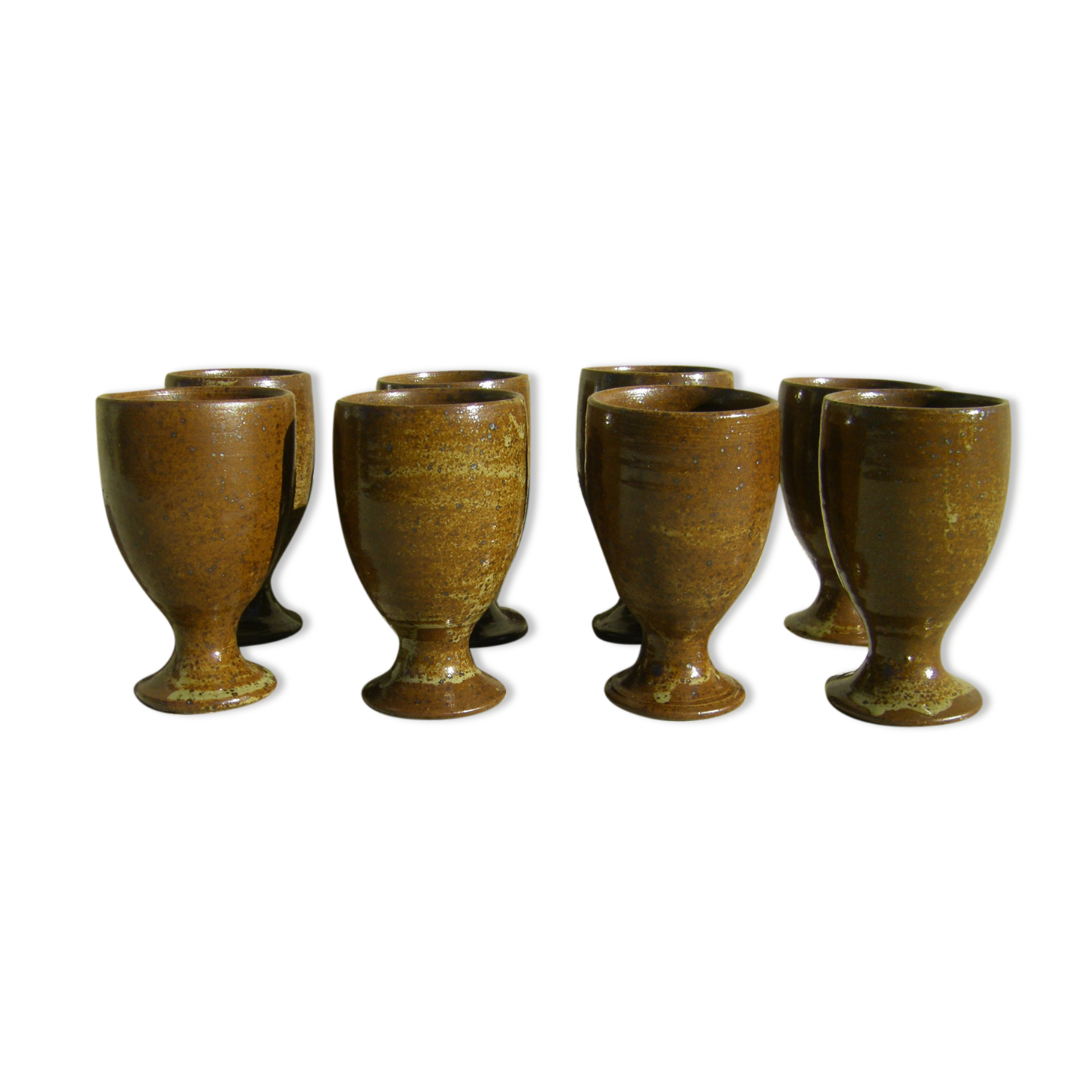 Eight vintage stoneware walking glasses